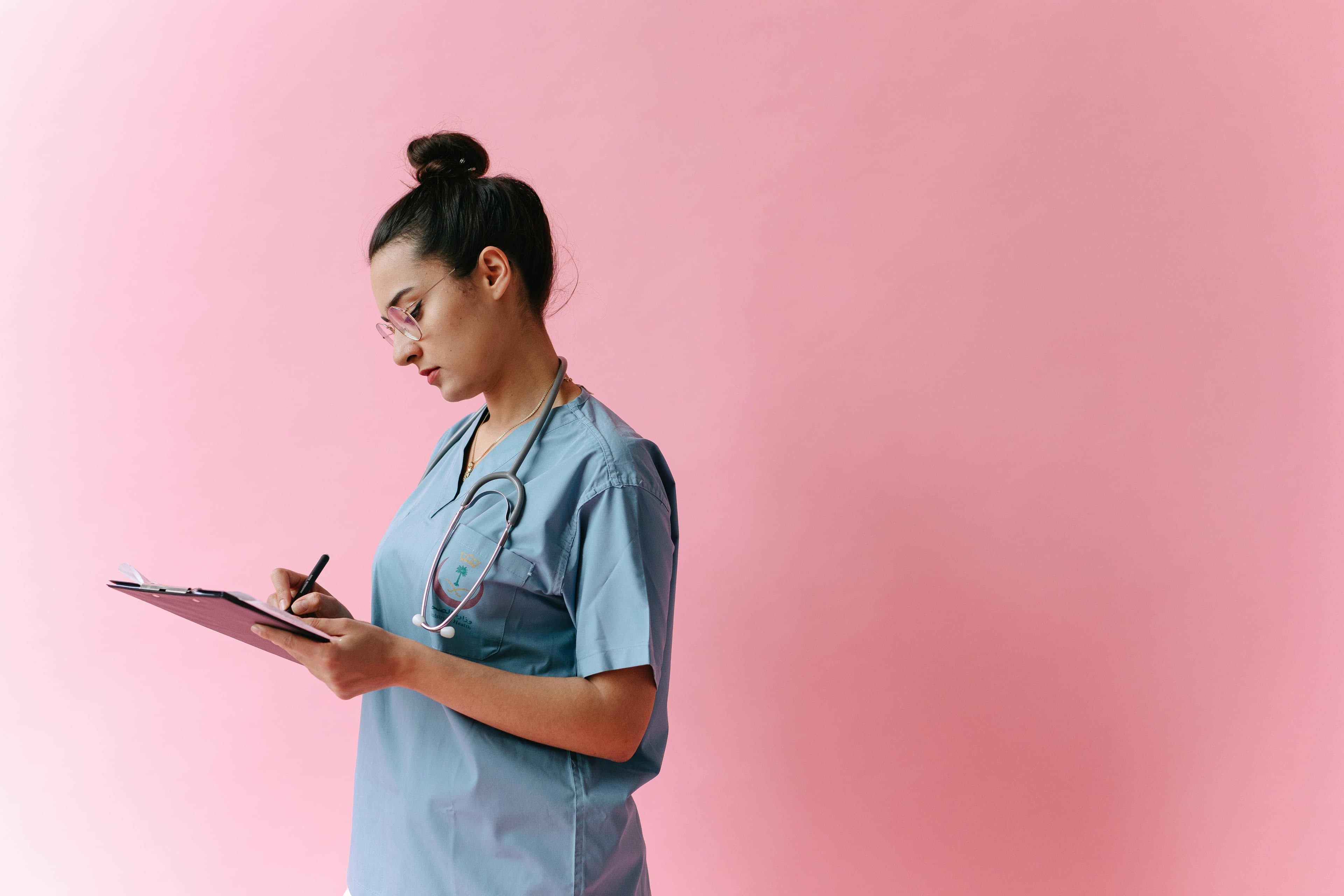 Licensed practical nurse reviewing care plan documentation.